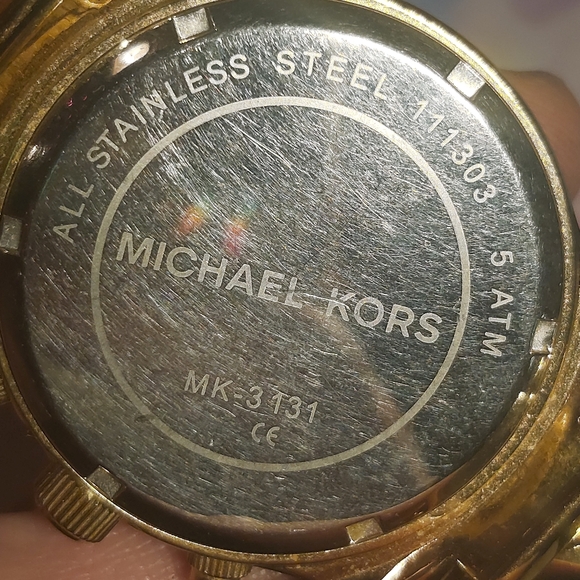 Gold Michael Kors women\'s wrist watch